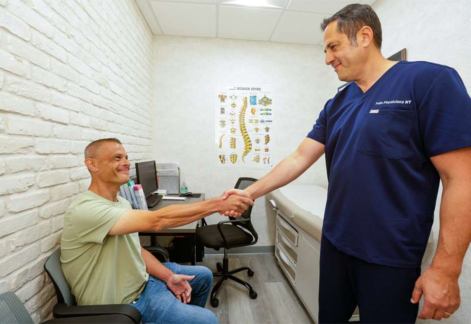 Dr. Leon Reyfman, MD with patient